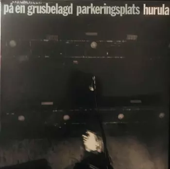 På En Grusbelagd Parkeringsplats