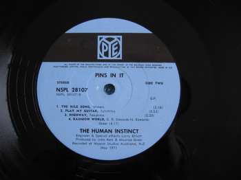 LP The Human Instinct: Pins In It